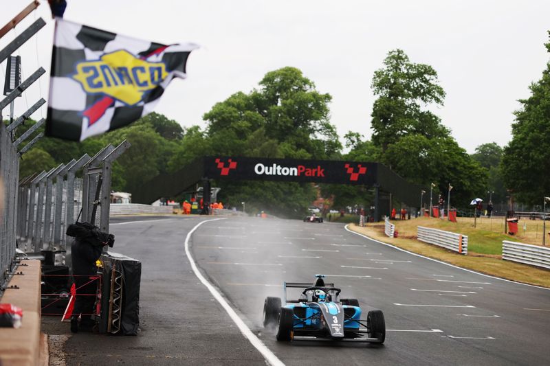 Alex O'Grady masters wet conditions to win topsy turvy race one at Oulton Park