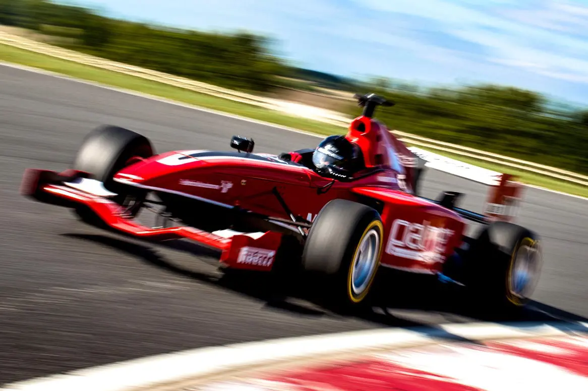 Formula 3000 at speed - view from front left
