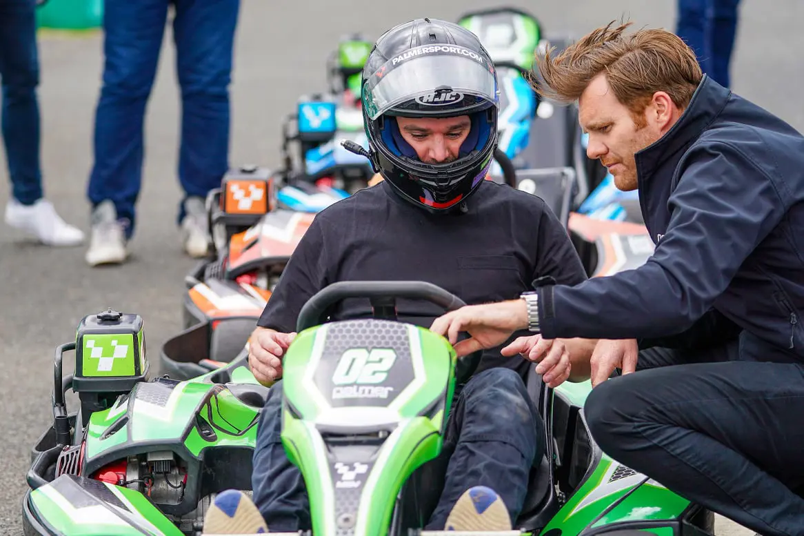 Instructor talking to guest in Sodi GT5 Kart