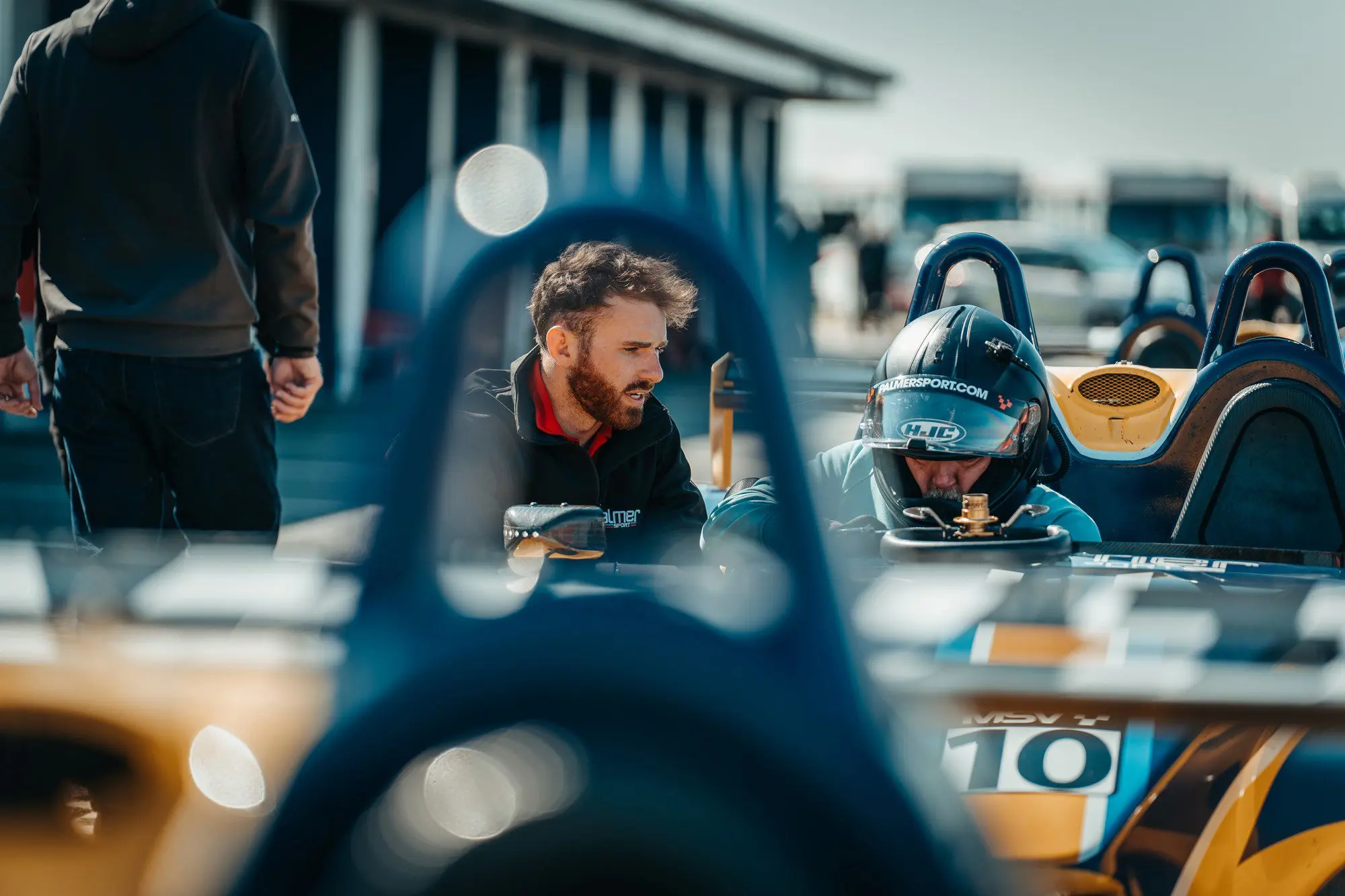 Instructor talking to guest driving the Palmer JP-LM